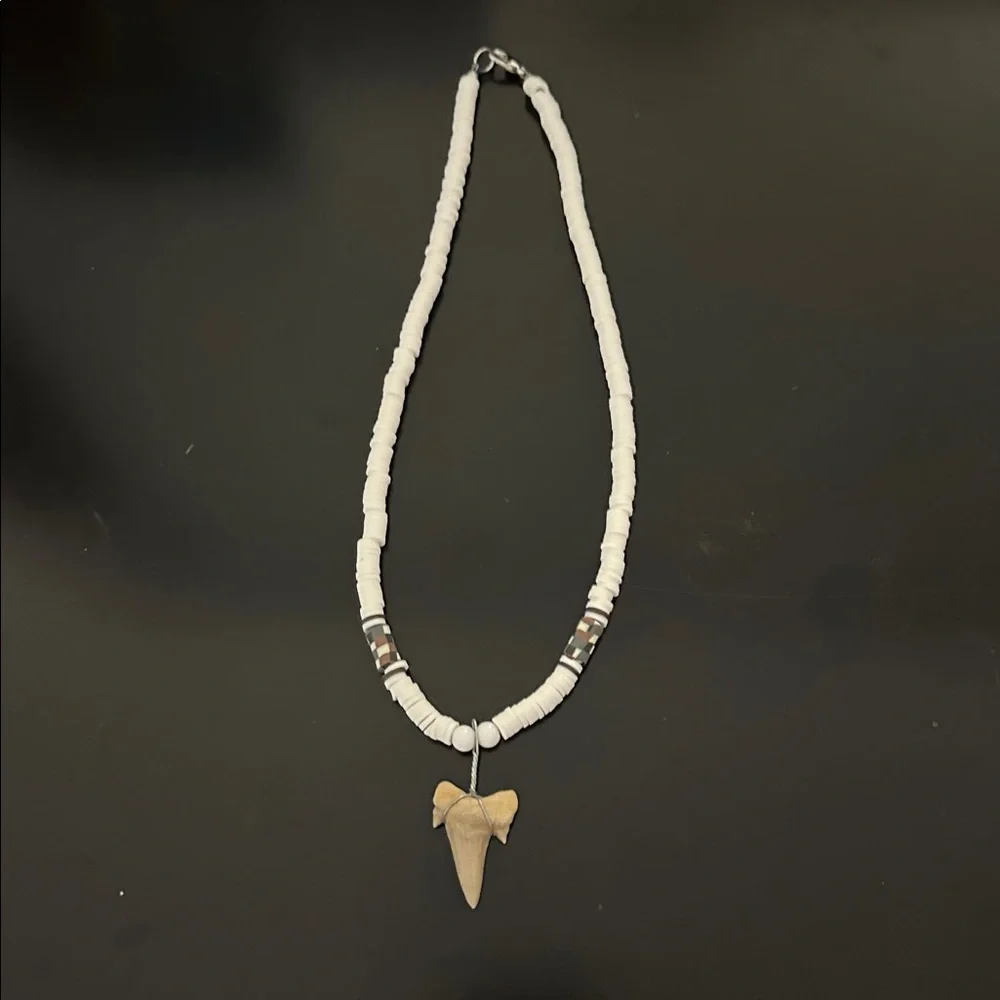 Three shark tooth necklaces